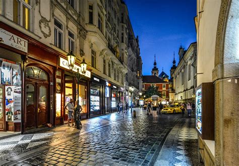 Woman walking through Old Town streets in Prague, Czech Republic stock ...