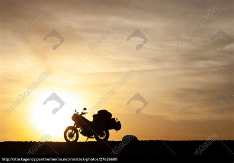 Silhouetted touring motorcycle at sunset - Royalty free photo #27626680 ...