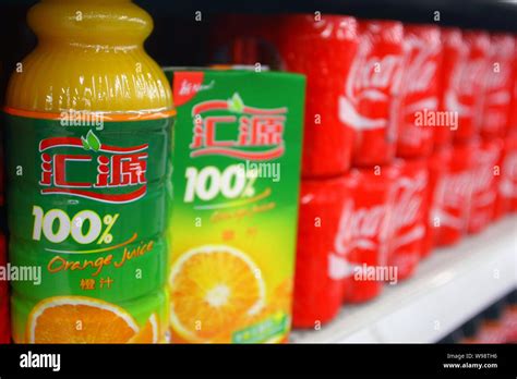 --File-- Bottles of Huiyuan juice and cans of Coca-Cola coke are seen ...