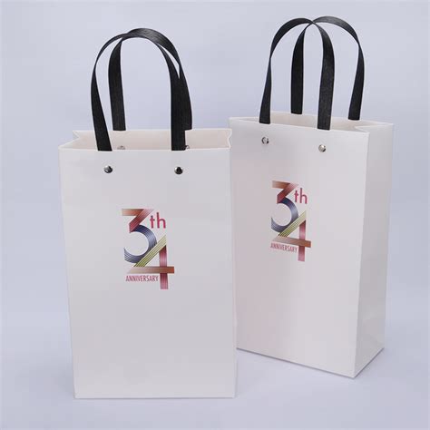 礼品袋定制工厂直销口罩手挽袋物业耐提礼物袋定做手提创意纸袋厂-阿里巴巴
