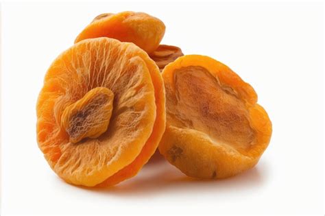 Premium Photo | Bright orange dried apricots with kernels on white ...