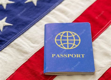 Premium Photo | Blue passport on usa flag background close up view