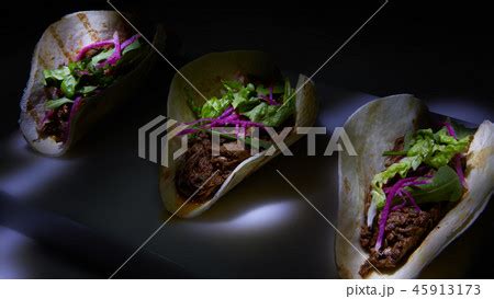 Three pork carnitas street tacos in yellow corn...の写真素材 [45913173] - PIXTA