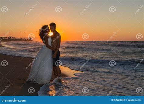 Newly Wed Young Couple on a Hazy Beach at Dusk Stock Photo - Image of ...