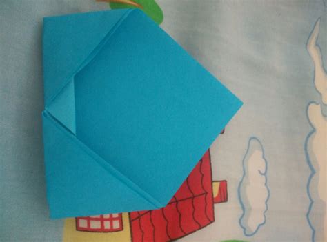 儿童学习简单的折纸 使用的彩纸小钱包折叠过程╭★肉丁网