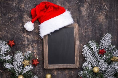 Premium Photo | Christmas dark background with santa hat