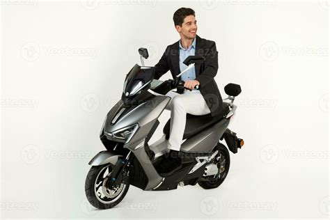handsome man riding on electic motorbike scooter isolated on white ...