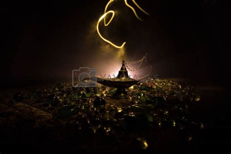 Lamp of wishes concept. Antique Aladdin arabian nights genie style oil ...