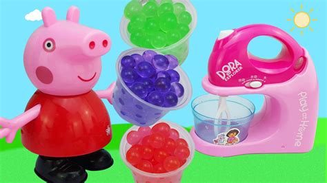 小猪佩奇把彩色水舞珠珠放进水果榨汁机玩具，搅拌出漂亮的冰沙_腾讯视频