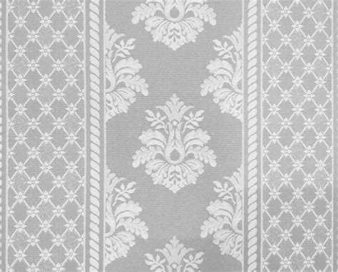 Premium Photo | A gray and white wallpaper with a floral design.