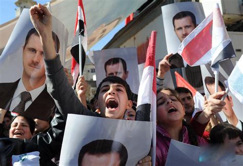 叙利亚政府支持者集会 要求结束动荡局面（组图）_第一金融网