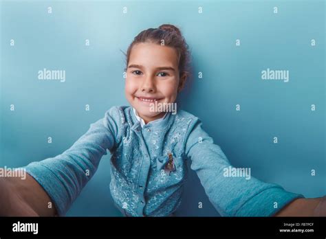 teen girl of European appearance seven years, holding the camera Stock ...