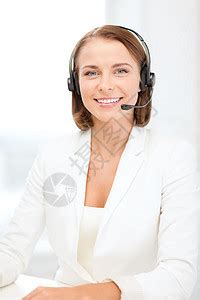 手持耳机 微笑着的女性求助热线接线员办公室人士服务台顾问接待员技术顾客麦克风商业助手高清图片下载-正版图片322216691-摄图网