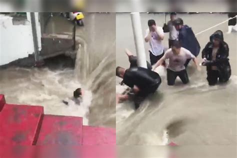 惊险！郑州一女子被大水冲走 众人接力拼死救回