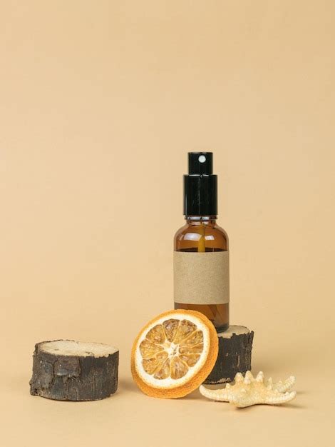 Premium Photo | Spray bottle dried orange and starfish on beige ...