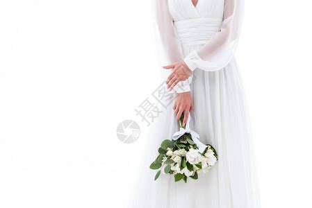 美丽新娘抱着婚礼花束看着窗高清图片下载-正版图片503001910-摄图网