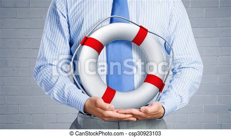 Life insurance. Close up of businessman with life buoy in hands. | CanStock