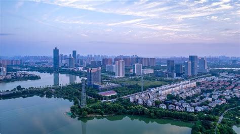 东西湖与武汉市区已完全融为一体，为何不将其划入中心城区？_发展