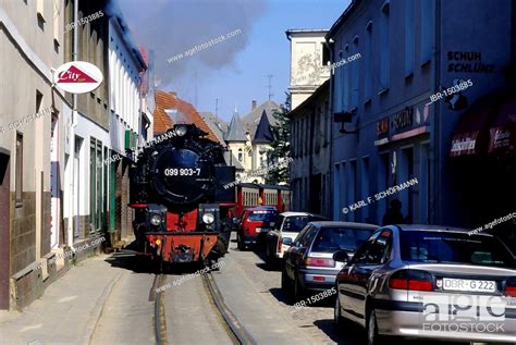 Schmalspurbahn Molli, a narrow-gauge railway, driving next to cars, Bad ...